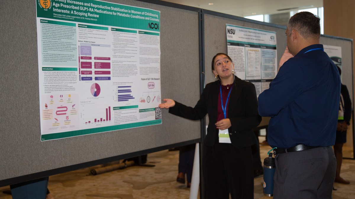 Student Presenting Research Poster