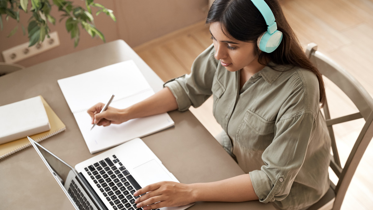 Woman studying in front of a laptop