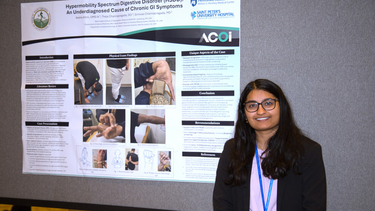 Kesha Amin with her poster