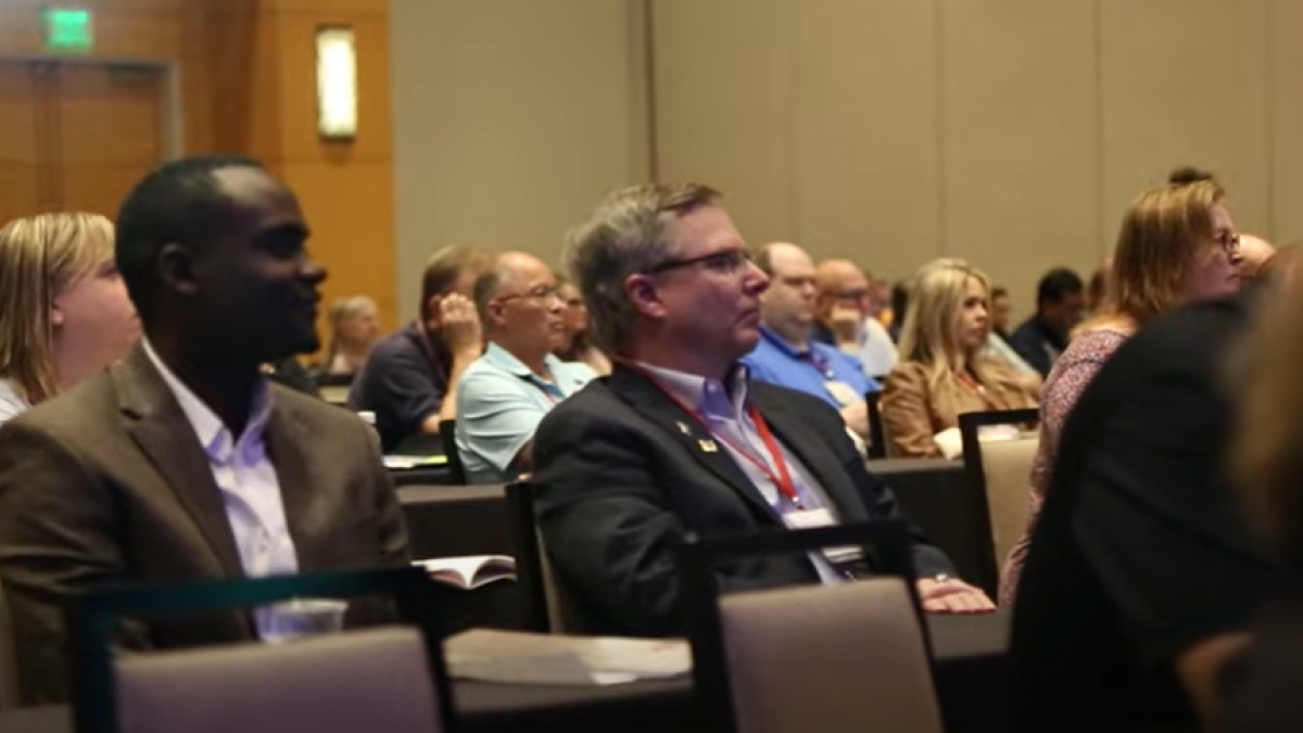 Members Watching a Lecture at an ACOI Conference