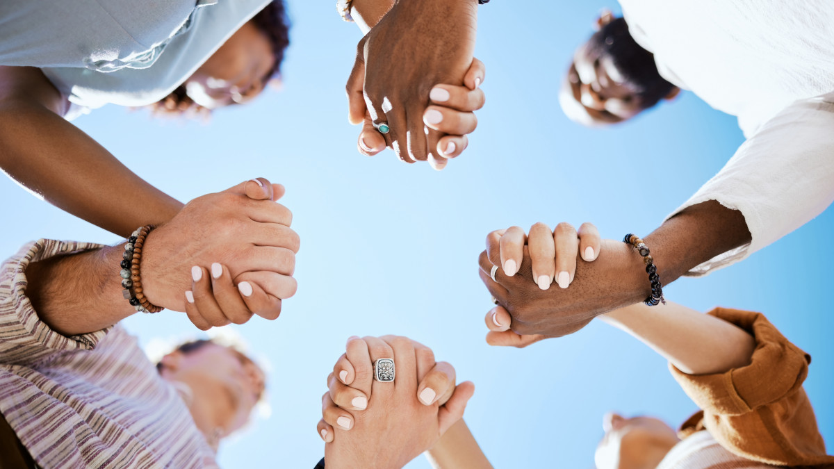 Group of friends holding hands