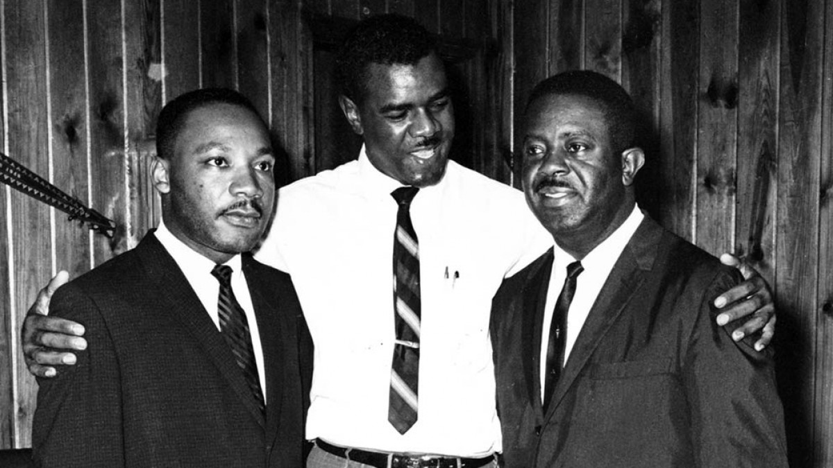 William G. Anderson, DO (center), welcomes the Rev. Martin Luther King Jr., PhD (left), and the Rev. Ralph David Abernathy to his home.