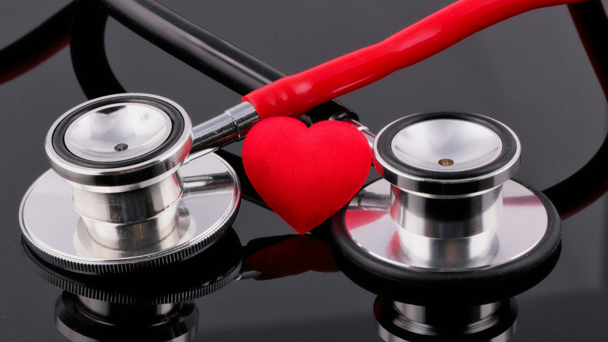 heart health photo with stethoscopes and heart shape