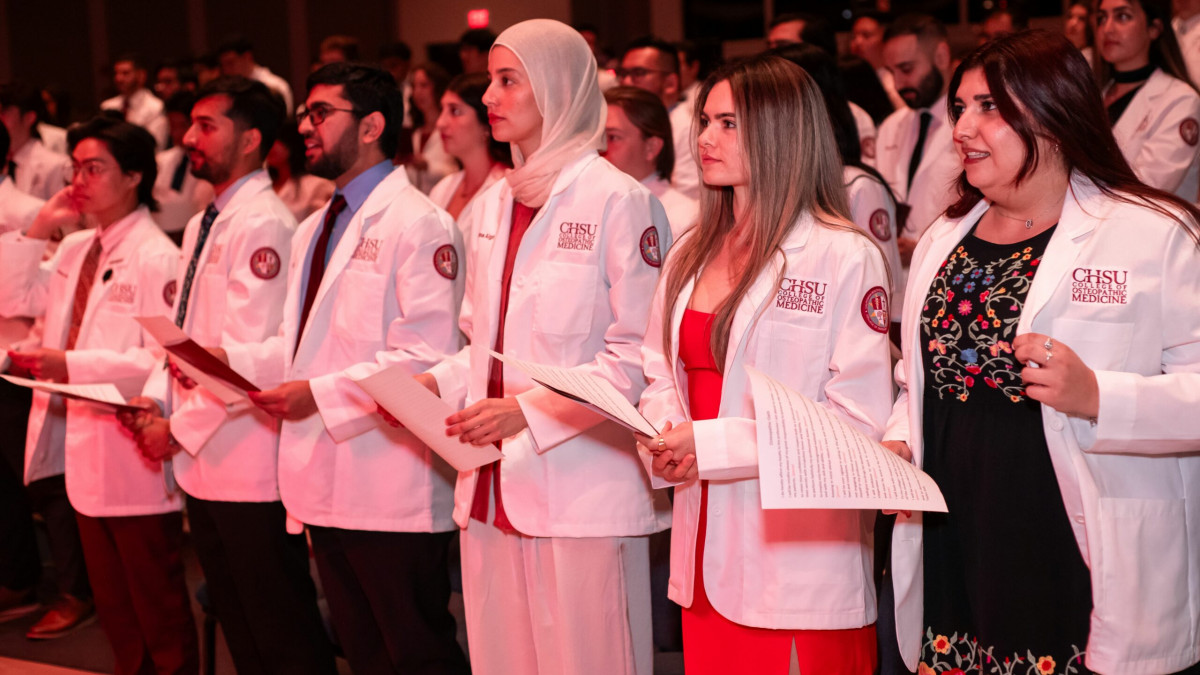 Students reading the osteopathic oath
