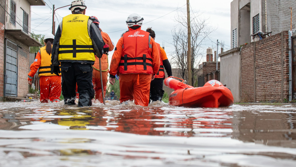 flooded streets with rescue workers