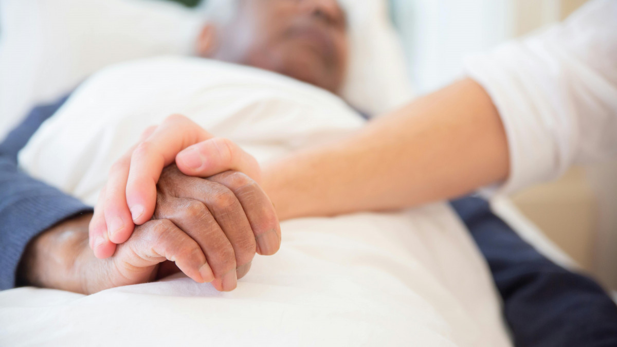 person holding patient hand