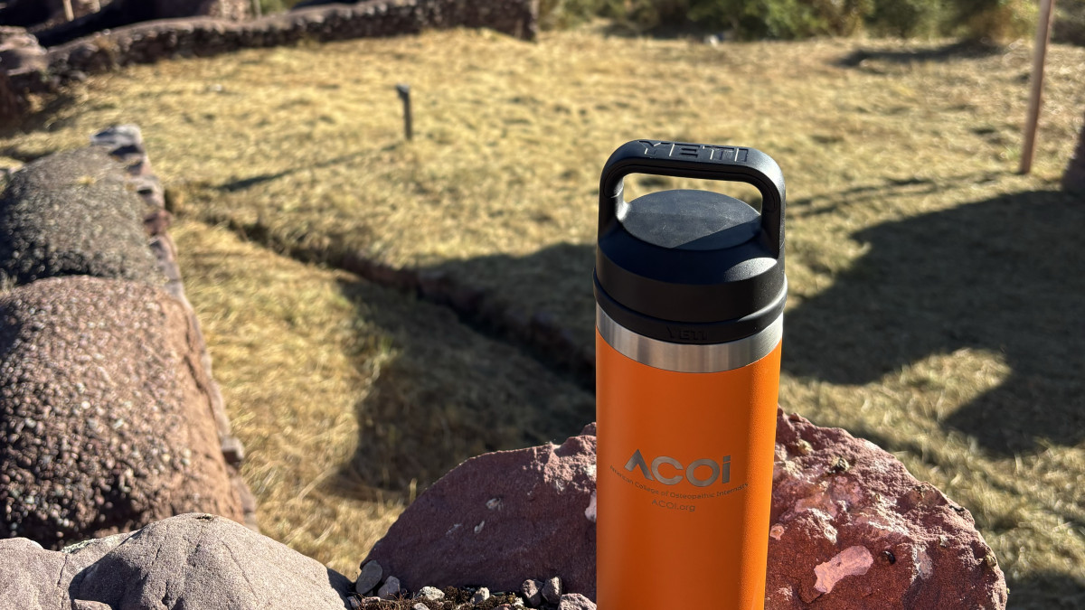 An ACOI water bottle overlooking the scenery in Cusco, Peru