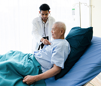 Hospitalist checking on a patient